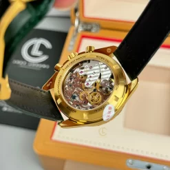 Đồng Hồ Omega Speedmaster Moonwatch 310.60.42.50.10.001 42mm Green Dial Yellow Gold Replica 1:1 – Top Quality Version